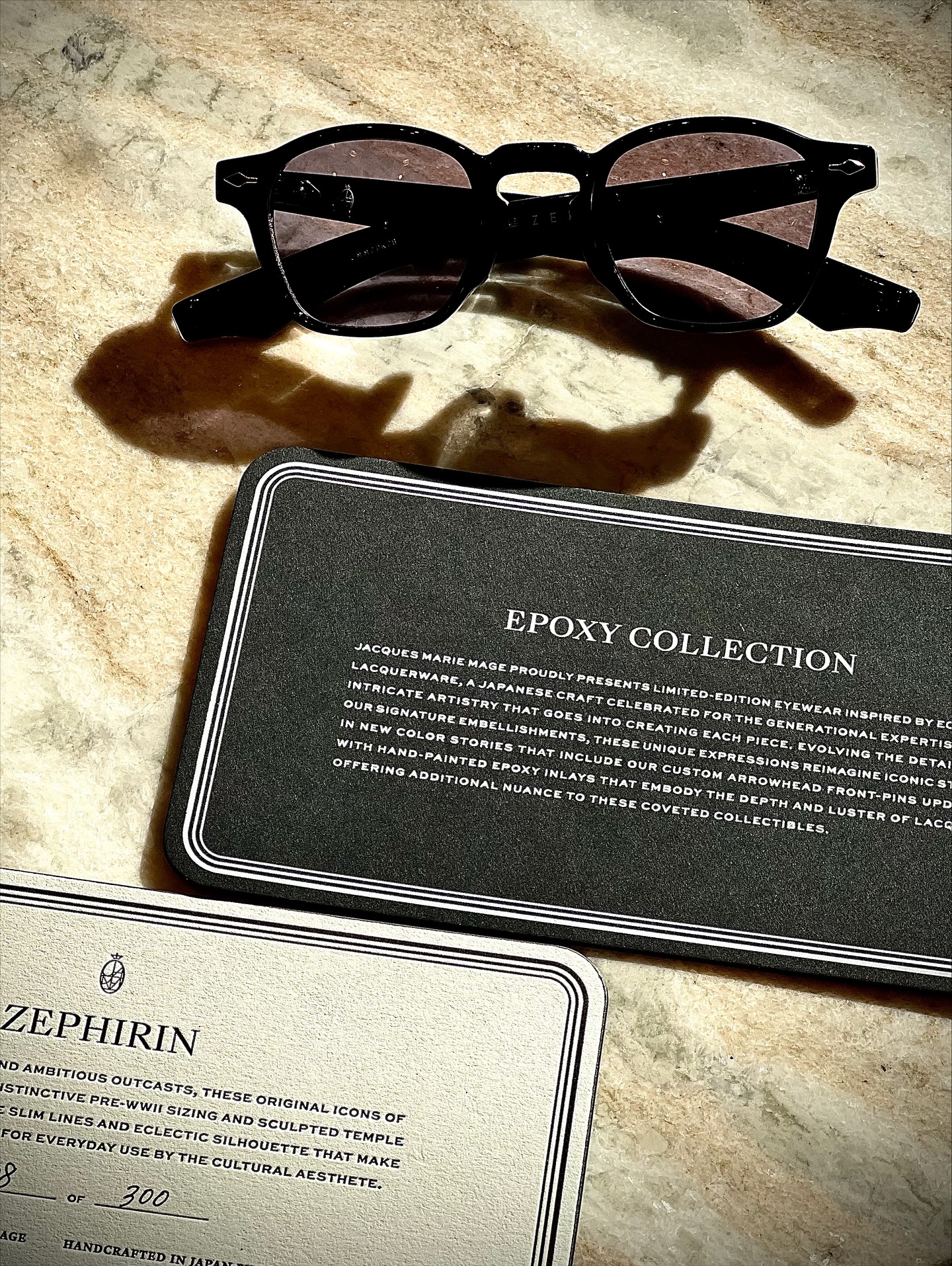 EPOXY ? :ZEPHIRIN FUMÉE by JMM入荷】
本日ジャックマリーマージュのEPOXY ?が入荷いたしました。
モデルはアイコンモデルZEPHIRINサイズ44になります。
カラーはブラックをベースにアローヘッドにはエポキシ仕様の特別中1本に仕上げられています。
眼鏡の生産地としても名高い福井県鯖江市が誇る日本の伝統工芸の1つ"越前漆器"の落ち着いた光沢と洗練された輝きにインスピレーションを得てフレームカラーと同じカラーのエポキシ樹脂を手塗りでアローヘッドフロントピンをほどこし、ナバホ族のネイティブアメリカンが由来となってるジュエリーの"バゲットカット"を再現したワイヤコア(芯金)に採用することでJ.M.Mのクラシックアイコンから新たなイメージを放つアイテムとして昇華させています。
是非新しいエポキシコレクションをお試しください!
brand : Jacques Marie Mage
mod : ZEPHIRIN size44
col : FUMÉE
? shop data ?
::: ボズュー麻布 :::
最寄り駅 麻布十番駅
5b出口から徒歩約1分
住所 106-0045
東京都港区麻布十番1-10-12須田ビル 1F
?03-6230-9983
azabu@beauxyeux.jp
EPOXY II: ZEPHIRIN FUMÉE by JMM Now in Stock
Jacques Marie Mage's EPOXY II arrived today.
This model is the iconic ZEPHIRIN, size 44.
The base color is black, with a special epoxy-coated arrowhead.
Inspired by the subdued luster and refined brilliance of Echizen lacquerware, a traditional Japanese craft from Sabae City, Fukui Prefecture, a renowned eyewear production region, the arrowhead front pin is hand-painted with epoxy resin in the same color as the frame. The wire core recreates the baguette cut of jewelry originating from Navajo Native Americans, elevating J.M.M.'s classic icon into a new piece.
Be sure to try out the new epoxy collection!
@jacquesmariemage
@beauxyeux_jiyugaoka